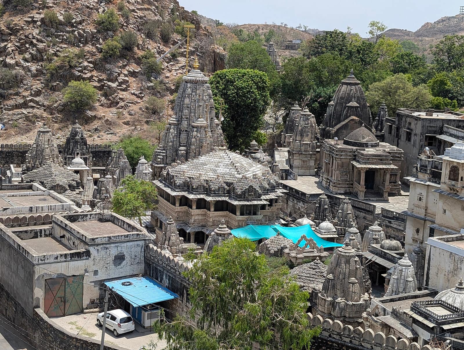 The Eklingji temple complex from above, its carved stone spires crowded below a rocky hill