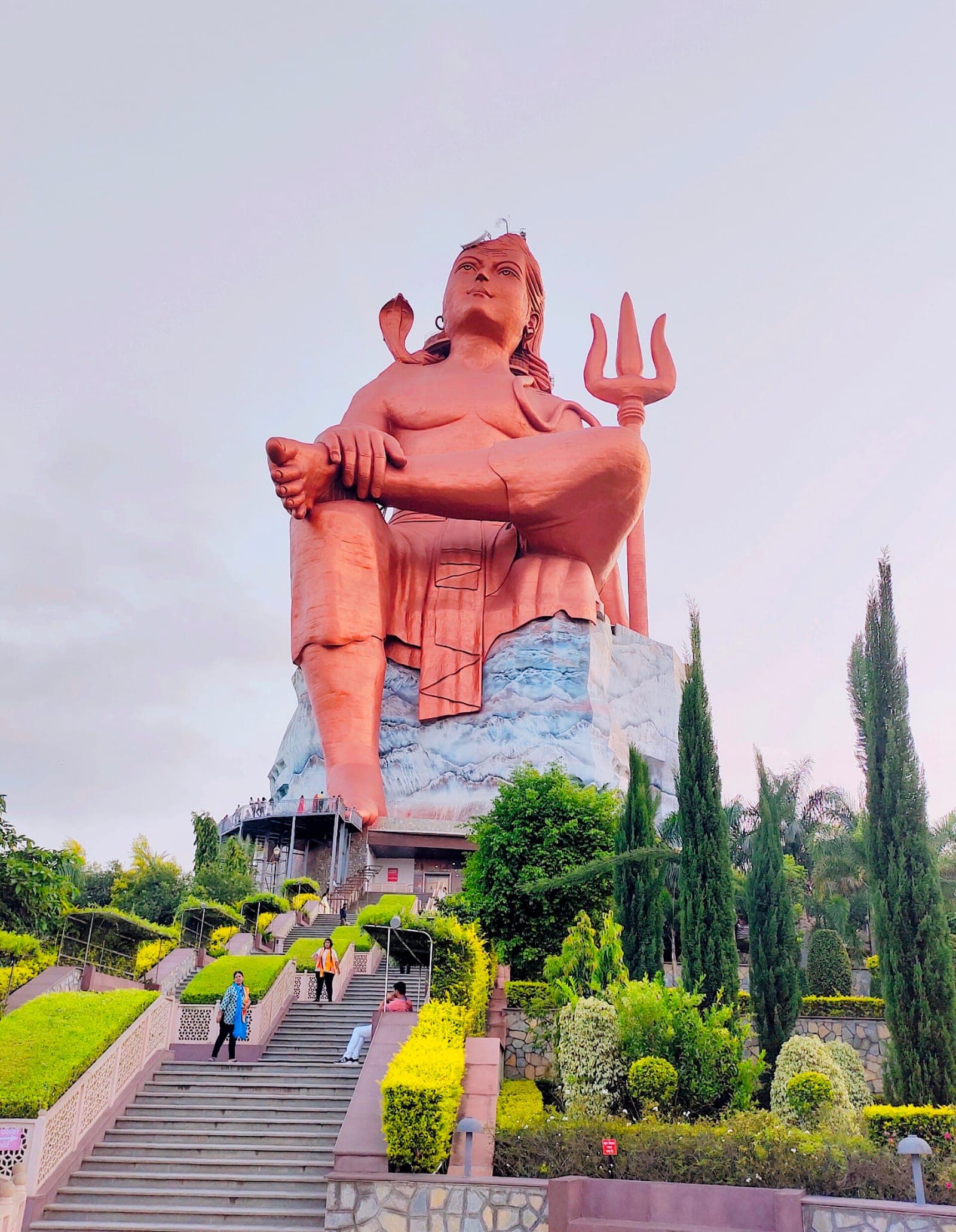 The Statue of Belief, a giant seated Shiva, above landscaped steps at Nathdwara