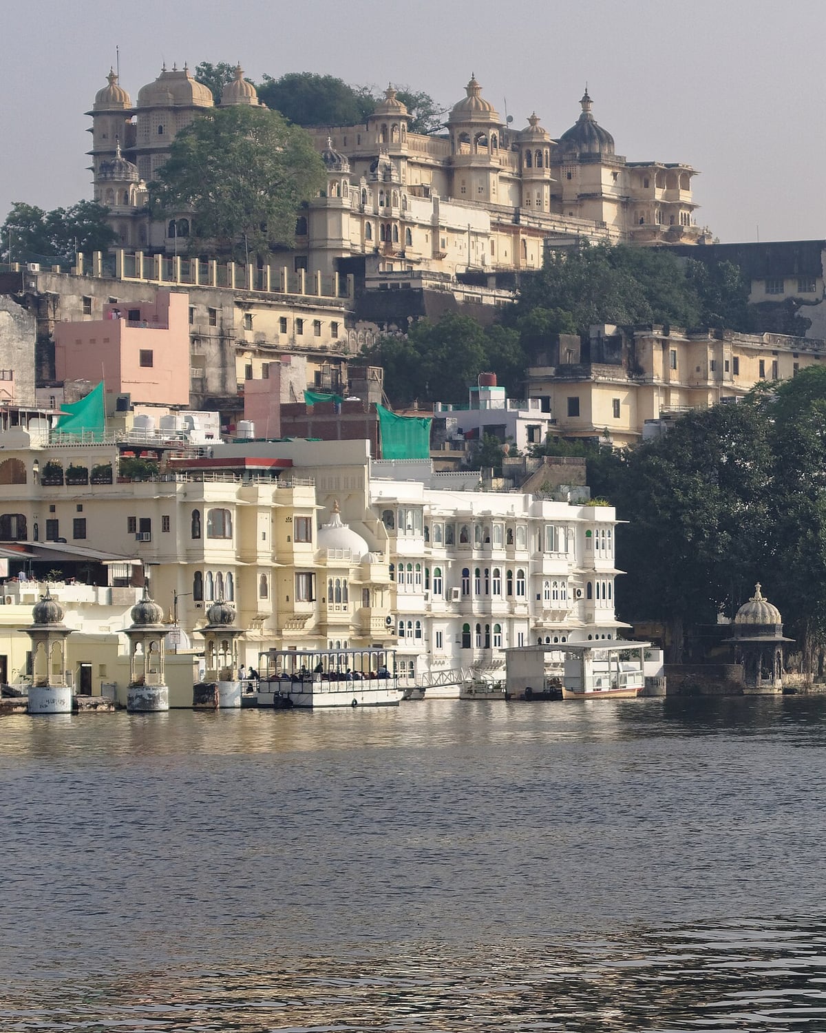 The City Palace rising above the ghats of Lake Pichola